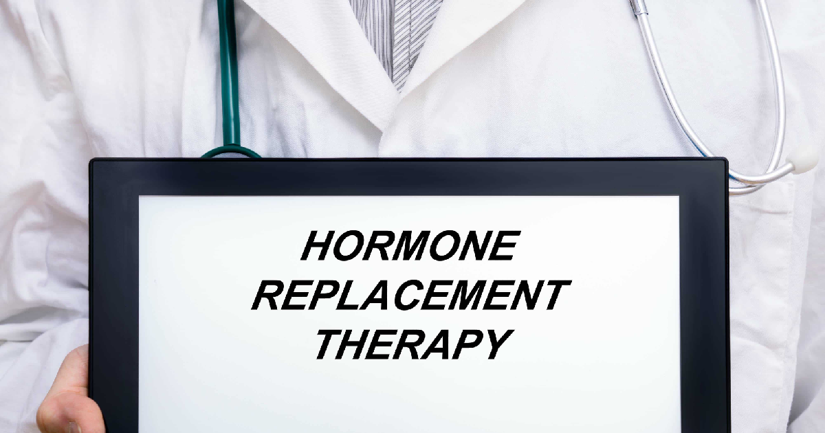 Doctor holding a tablet displaying the words Hormone Replacement Therapy in OKC